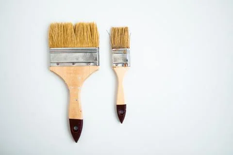 Two paintbrushes on white background with copy space Stock Photos