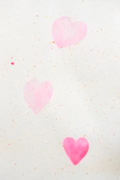 Two painted pink hearts on a paper Stock Illustration