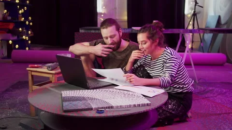 Two painters are looking through documents and searching on the Internet Stock Footage 155907075