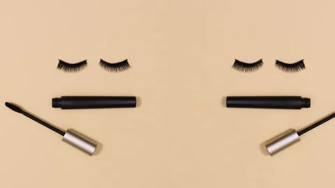 Two pairs of eye lashes blinking with appearing mascara. Stop motion Stock-Footage 150831184