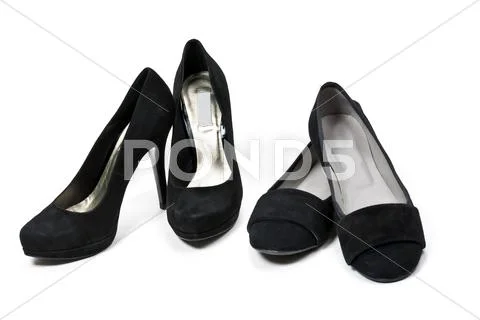 Two pairs of female black suede shoes Stock Photos