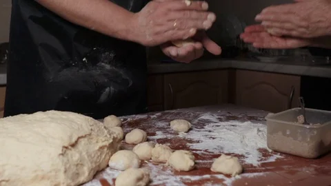 Two pairs of hands make stuffed pies Stock-Footage 124960185