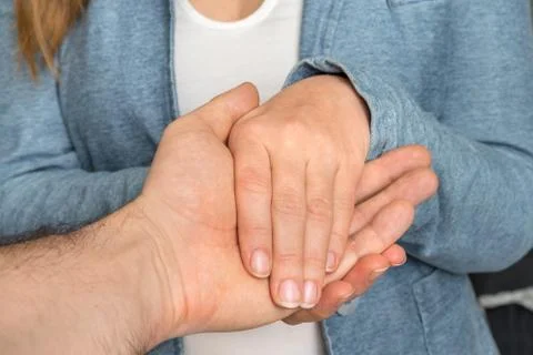 Two pairs of hands touch each other - together, helping, support, sympathy, e Stock-Fotos