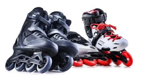 Two pairs of inline skates isolated on white background. Stock Photos