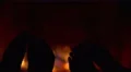 The two pairs of legs by the fireplace background close up view 4k or 4k+ Resolution