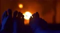 The two pairs of legs by the fireplace background close up view 4k or 4k+ Resolution