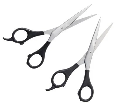 Two pairs of scissors with a black handle and a silver blade Stock Photos