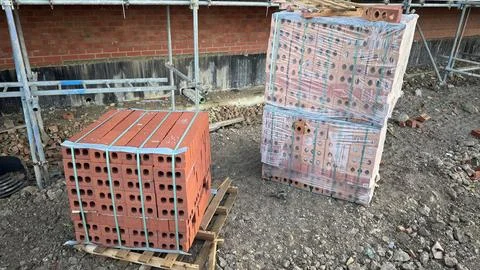 Two Pallets of Red Bricks at Construction Site Stock Photos
