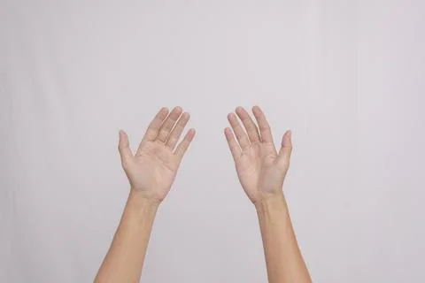 Two palms open up as a gesture of peace and giving thanks, isolated on whit.. Stock Photos