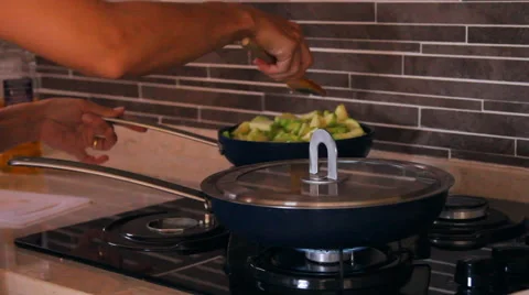 Two pan on the fire, vegetable marrow, zucchini mix in the pan, chicken fried Stock Footage 40216800
