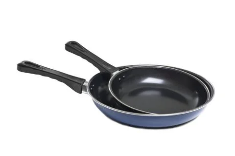 Two pans isolated on white background. Stock Photos