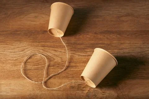 Two paper cups with thread Stock-Fotos