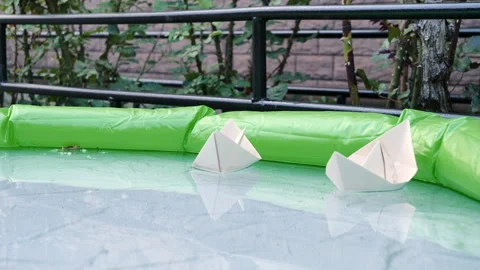 Two paper sheep are floating in the air pond Stock Footage 277360653