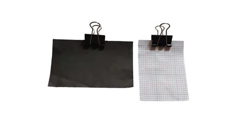 Two paper sheets with grid and solid black paper held by binder clips Stock Illustration