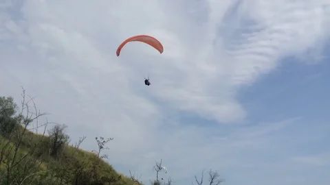 Two paraglider in the blue sky above the chamber 2 Stock Footage 73678835