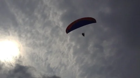 Two paraglider in the blue sky above the chamber Stock Footage 73678886