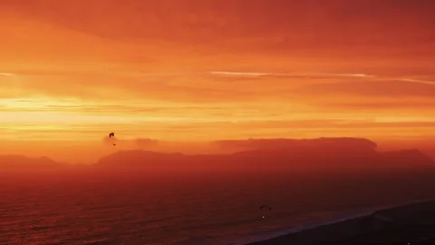 Two paragliders flying after sunset with navigating lights on. Stock Footage 266078378