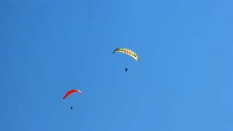 Two paragliding in sunny sky. Stock Footage 217406188