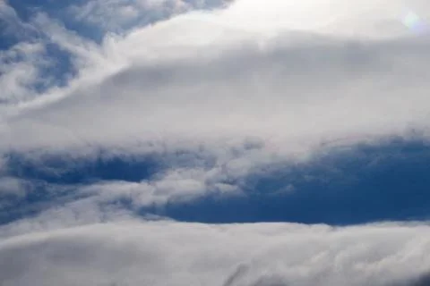 Two parallel clouds blue sky . Stockfoto's