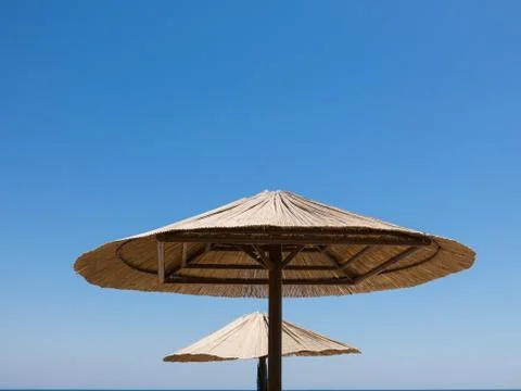 Two parasols made of straw Stock Photos