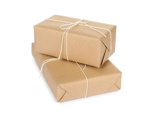 Two parcel boxes wrapped in paper isolated on white Stock Photos