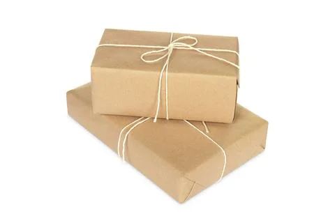 Two parcel boxes wrapped in paper isolated on white Foto stock