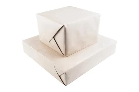 Two parcel wrapped with brown packing paper isolated on white Stock Photos