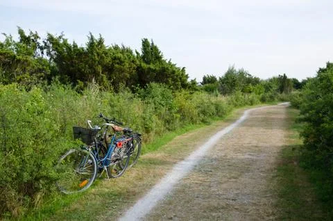 Two parked bikes Stock Photos