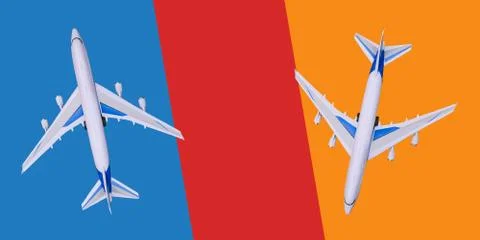 Two passenger planes fly in different directions. Sale and booking of tickets Stock Photos