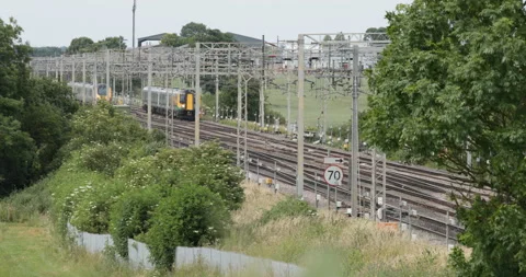 Two passenger trains passing Stock Footage 137466677