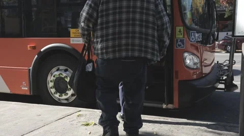 Two passengers boarding city bus Stock Footage 68446718