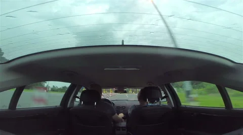 Two passengers in a car approaching the pay toll booth Stock Footage 41471058