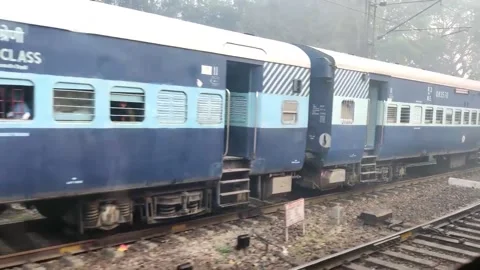 Two passengers trains cross each Stock Footage 229964170