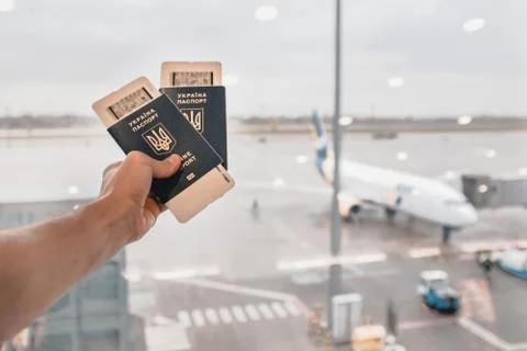 Two passports in hand Stock Photos