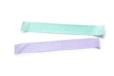 Two pastel grid pattern washi tapes, mint green and lavender purple, for craf Stock Photos