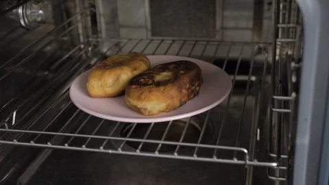 Two patties in the oven Stock Footage 88105991