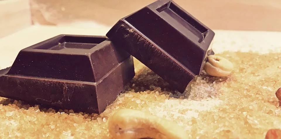 Two peaces of chocolate Stock Photos