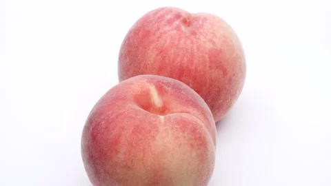 Two peaches turning. Stock Footage 308511461