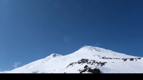 Two peaks of Elbrus, the Western peak and the Eastern peak in sunny weather Video stock 336313270