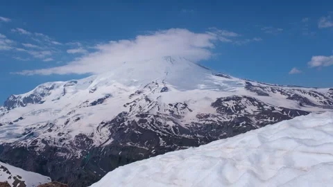 Two peaks of Elbrus, the Western peak and the Eastern peak in cloudy weather Stock Footage 340551448