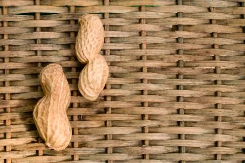 Two peanuts with braided background Stock Photos