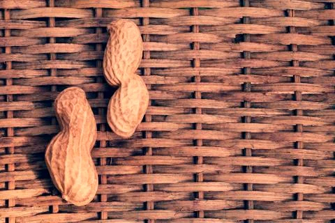 Two peanuts with braided background Stock Photos