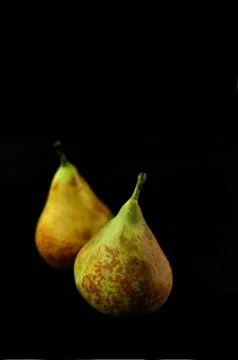Two Pears Isolated on Black Stock Photos
