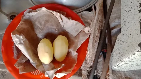 Two Peeled Potatoes Ready for Cooking Stock Footage 346746792