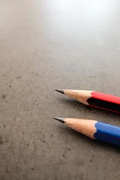 Two pencils on a dark gray table 스톡 사진