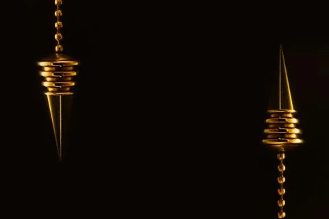 Two pendent designs in dark background Stock Photos