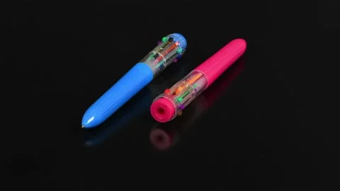 Two pens with colored refills on a black. Ten different colors. Stock Footage 170382204