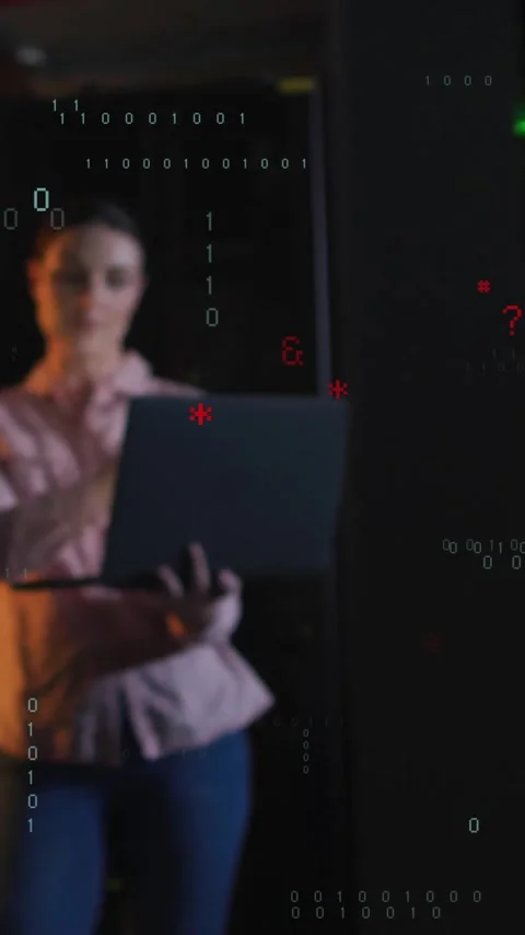 Two people analyzing data on laptop with binary code animation overlay Stock Footage 319727291