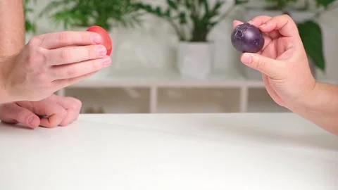 Two people are beating Easter eggs. tradition for Easter. Stock Footage 236659942