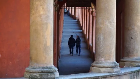 Two people are walking under tha famous portico Stock Footage